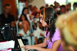 Student playing piano