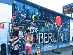 Berlin wall with students