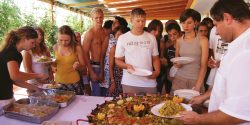 Students getting Paella