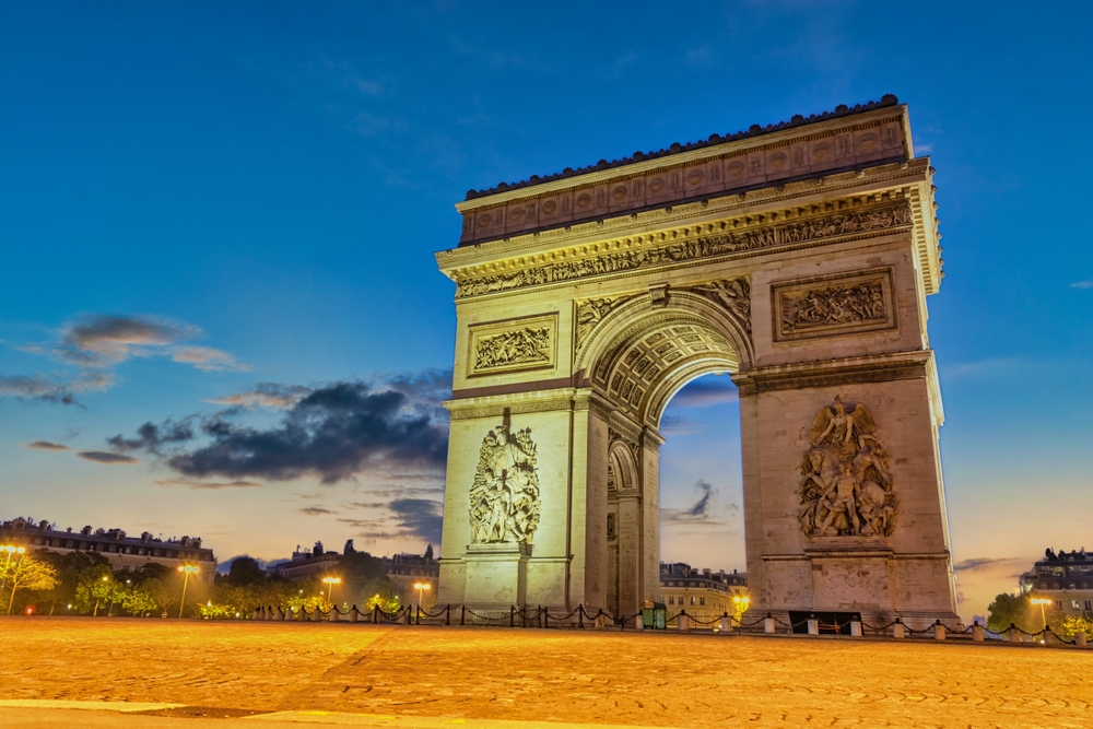 The Arc de Triomphe at night in Paris