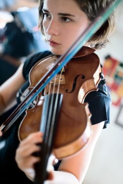 Girl with violin orchestra