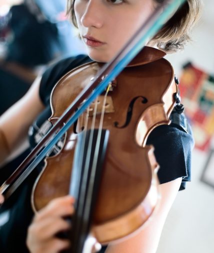 Girl with violin orchestra