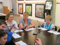students doing chiese calligraphy