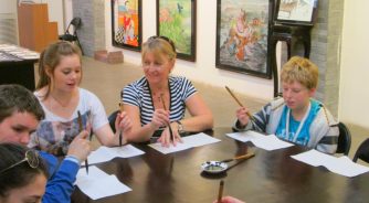 students doing chiese calligraphy