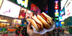 Holding,Two,Hot,Dogs,In,Nyc,On,The,Times,Square
