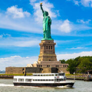 Statue,Of,Liberty,And,Tourist,Ship,Ferry,In,New,York