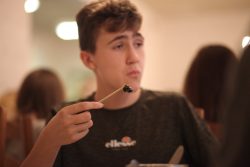 Boy eating a snail