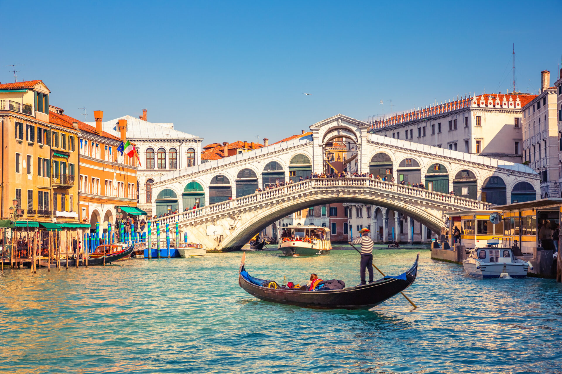 Gondola on the Grand Canal and Rialto Bridge in Venice, Italy