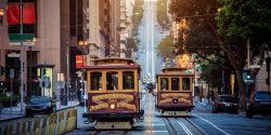 Classic,View,Of,Historic,Traditional,Cable,Cars,Riding,On,Famous