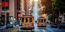 Classic,View,Of,Historic,Traditional,Cable,Cars,Riding,On,Famous