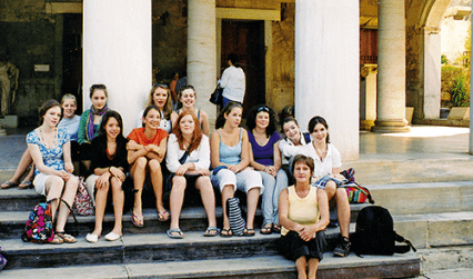 Students sitting on steps, Greece