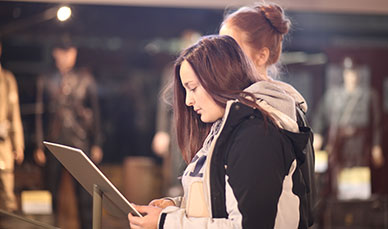 Students interacting with exhibit in museum, Normandy