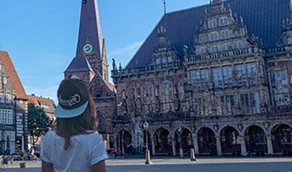 Student standing outside Bremen Town Hall