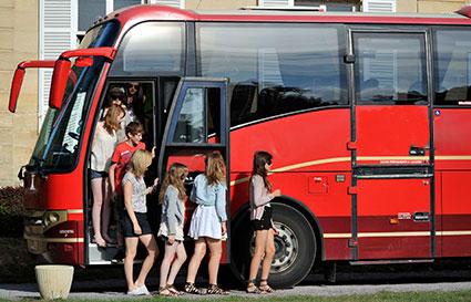 School coach outside the Château du Molay