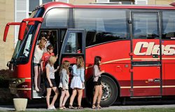 School coach outside the Château du Molay