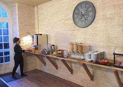 Château du Molay team member at the breakfast buffet