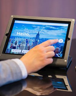 Man clicking on e-tablet