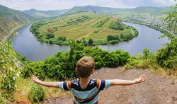 Student overlooking body of water