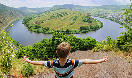 Student overlooking body of water