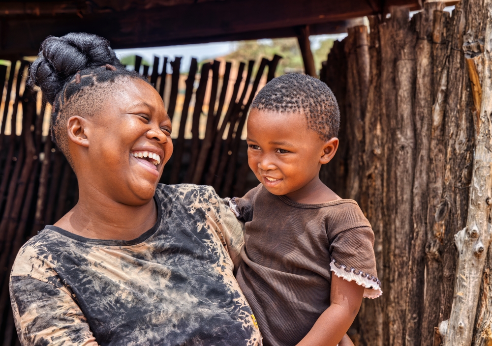 Happy mother holidng her child in her arms in South Africa