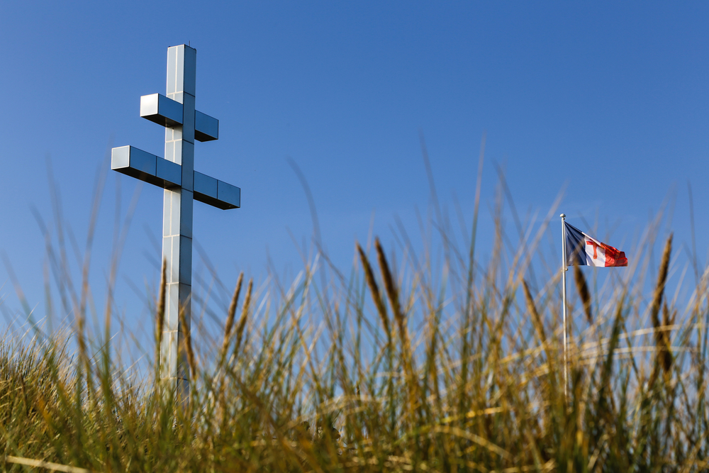 The Lorraine cross at Juno Beach against a blue sky background