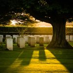 Golden sunlight over the Bayeux British War Cemetery in Normandy