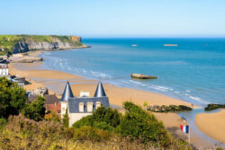 Panoramic view over Arromanches beach and the remains of the WWII Mulberry harbour