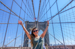 Happy student on the Brooklyn Bridge, New York
