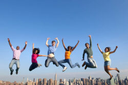 Happy students jumping in New York