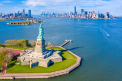 Aerial View of Statue of Liberty, Ellis Island and Lower Manhattan Skyline from New York Harbor