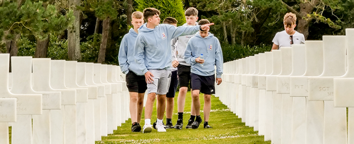 Students exploring the American Cemetery