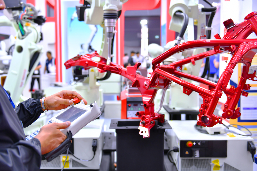 Engineer making checks in a motorcycle factory