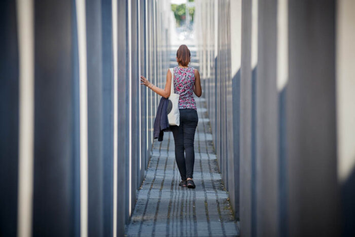 Berlin,,Germany.,Woman,Among,The,Blocks,At,The,Memorial,To