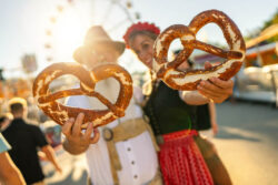 German people holding pretzels