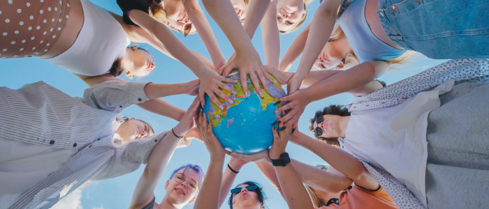 Students holding globe