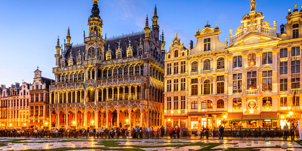 Wide angle night scene of the Grand Place and Maison du Roi in Brussels