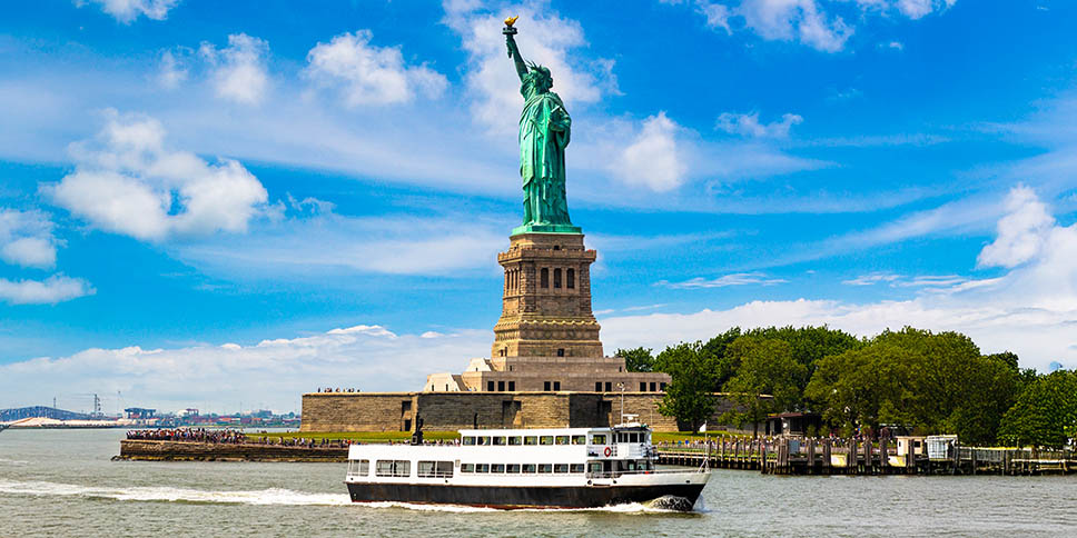 River cruise sailing past the iconic Statue of Liberty