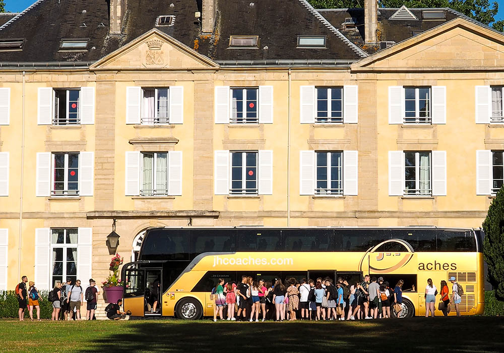 Students arriving at the Chateau du Molay by coach