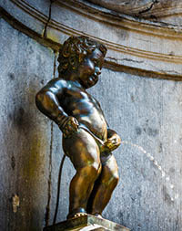 The famouns 'Manneken Pis', a landmark small bronze sculpture in Brussels, Belgium