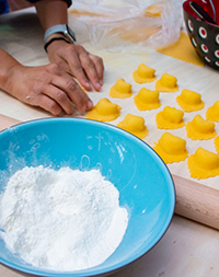 Student preparing ravioli at a pasta workshop at Grand Tour Italia