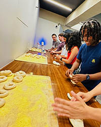 Students in a bagel-making class