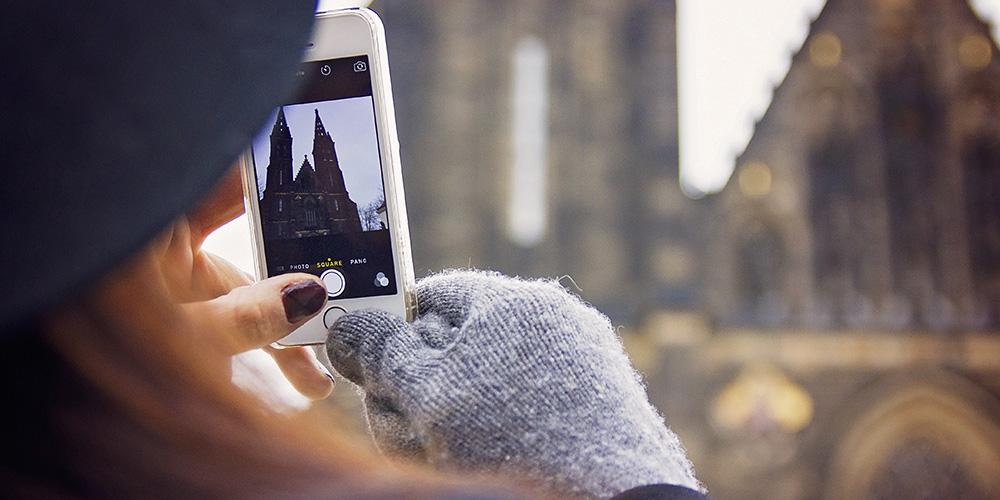 Student taking picture of the Church of St. Ludmila