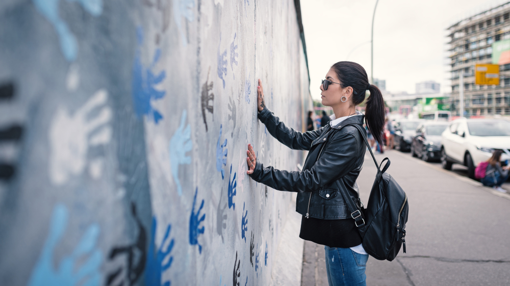 Student at the Berlin wall