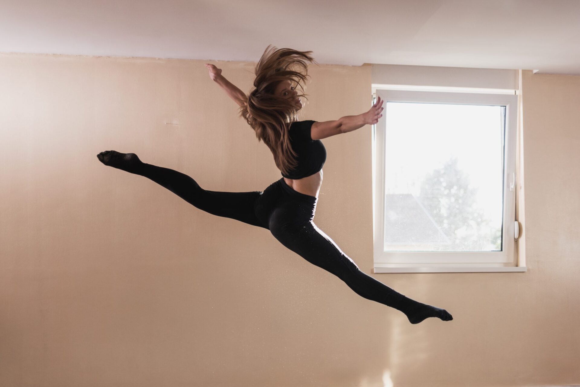A,Young,Woman,Dancer,In,Black,Clothing,Is,Performs,A