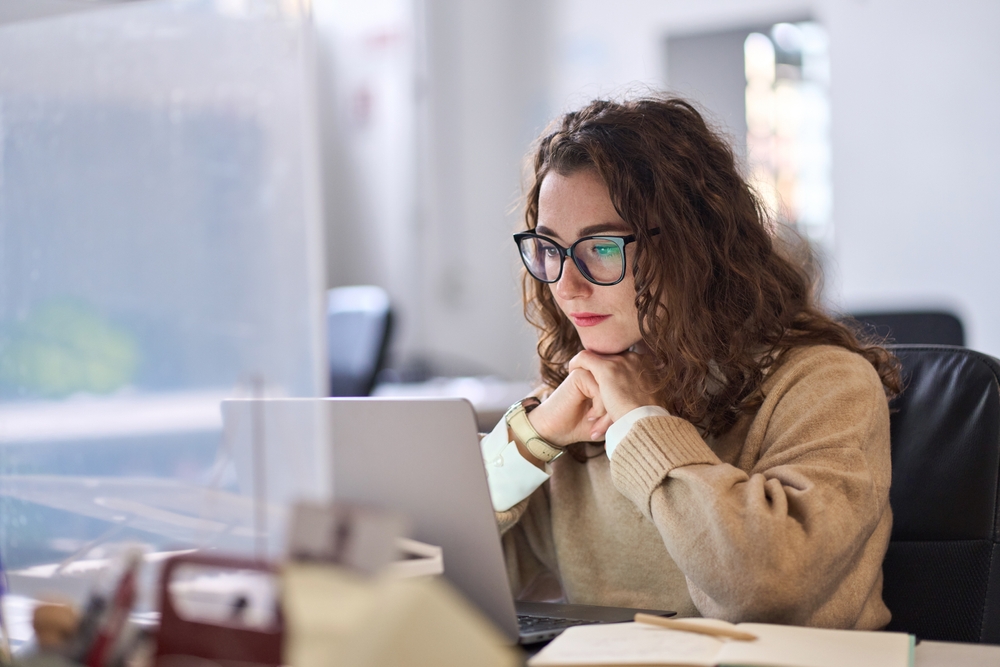 Female teacher researching how to book