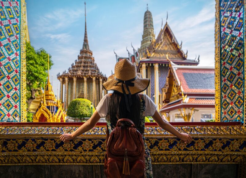 Girl looking at the Grand Palace in Bangkok, Thailand
