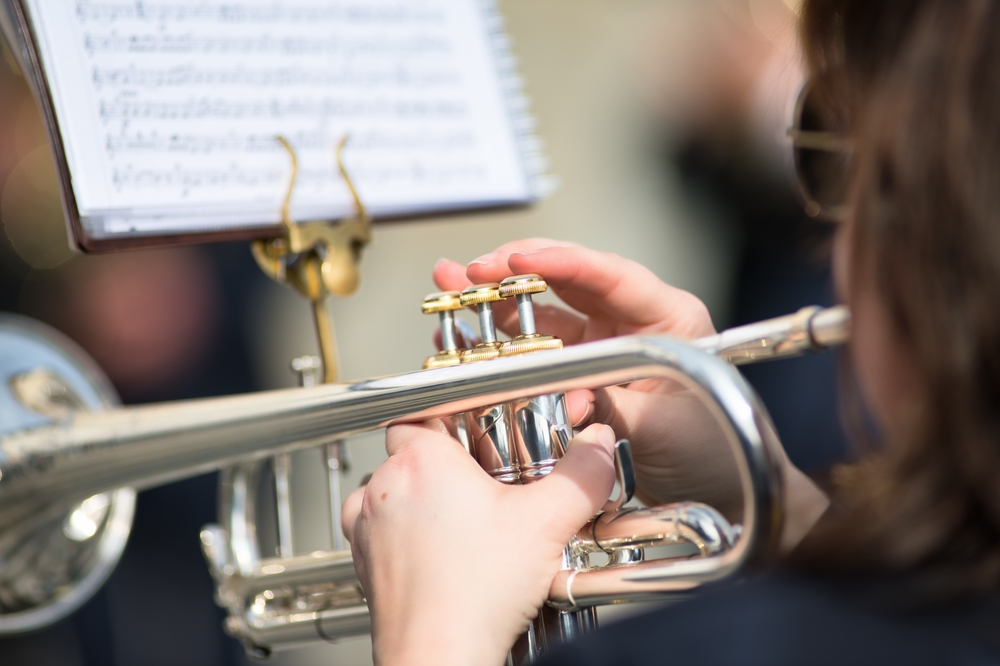 Student playing trumpet during a performance