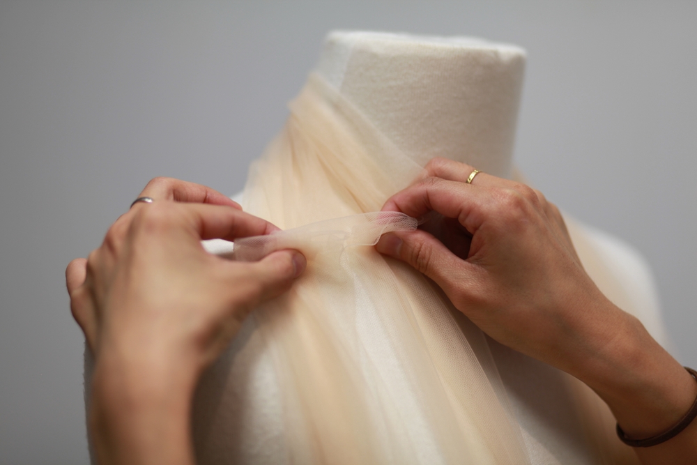 Fashion designer working on a garment