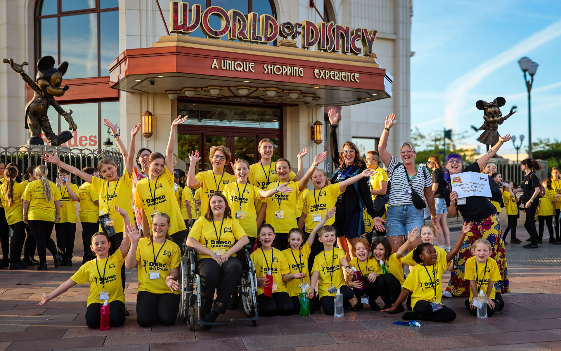 Stagecoach Dance The Dream students sitting and smiling in Disneyland