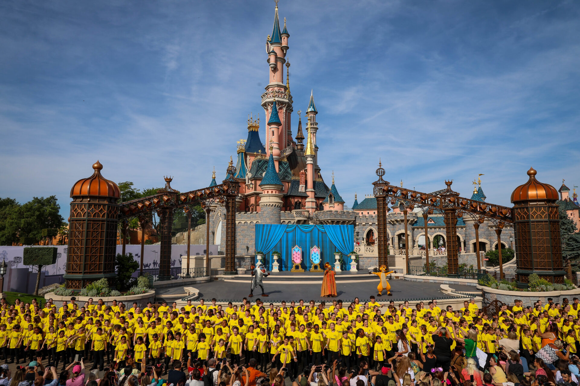 Stagecoach Performing Arts students singing in front of the Disneyland Paris Sleeping Beauty castle.
